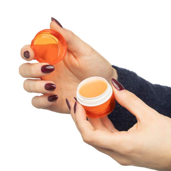 Baume à lèvres dans un pot en AS Malik